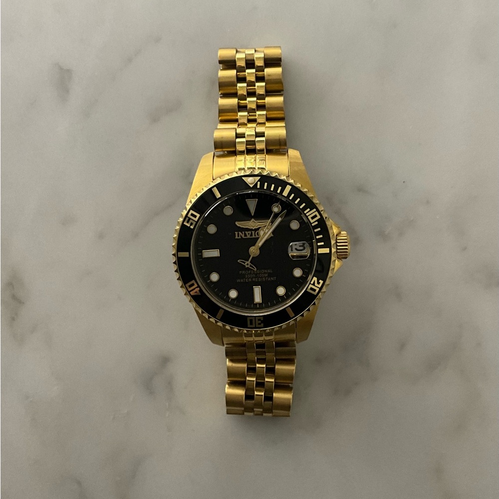 Women’s Invicta Gold and Black Quartz Watch